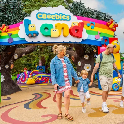 Family at the entrance of CBeebies Land at Alton Towers Resort